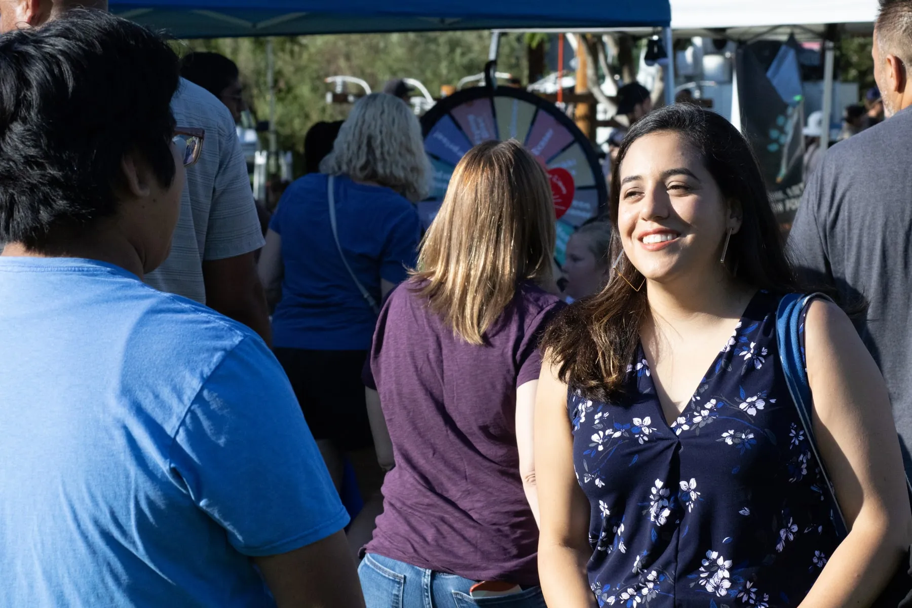 Nikki Perez talking with residents at a Burbank community event.