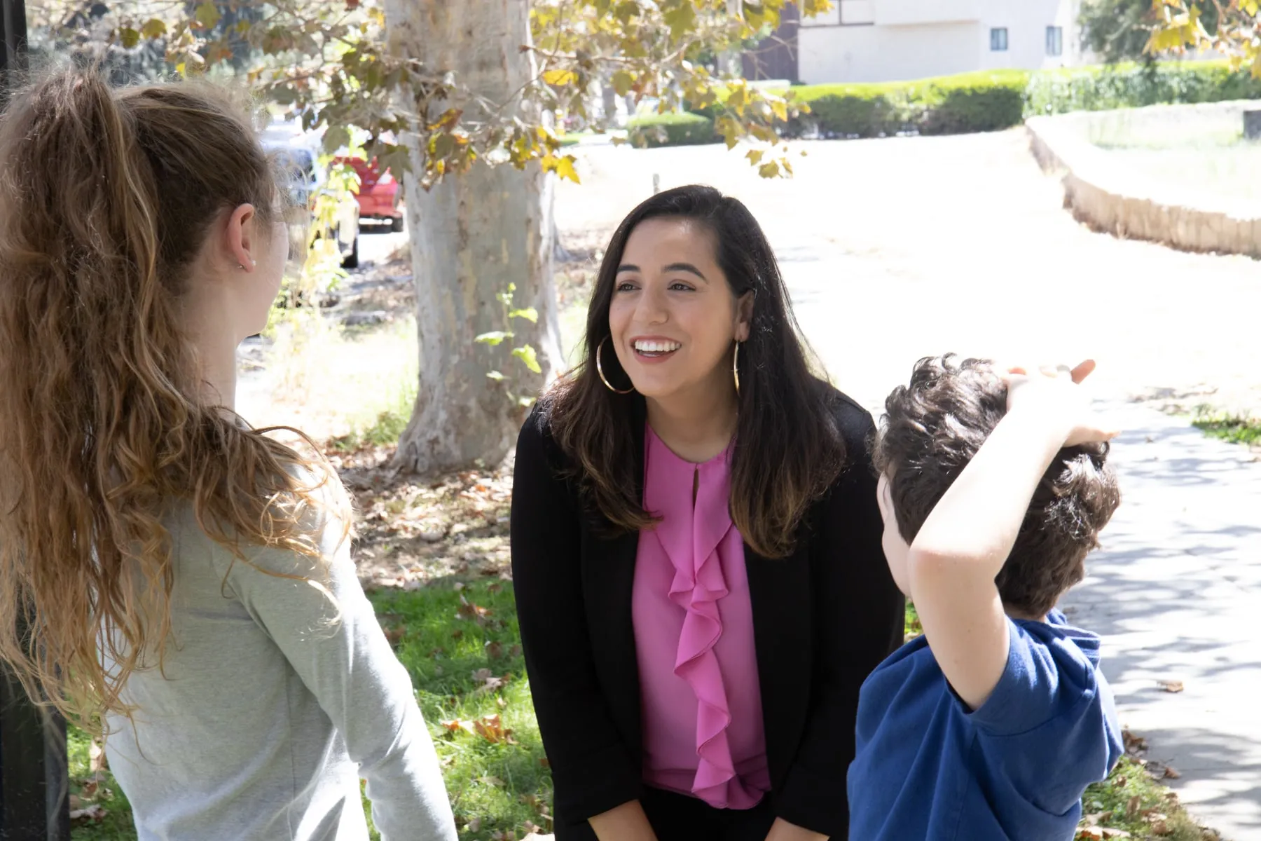 Nikki Perez speaking with children at a Burbank park.
